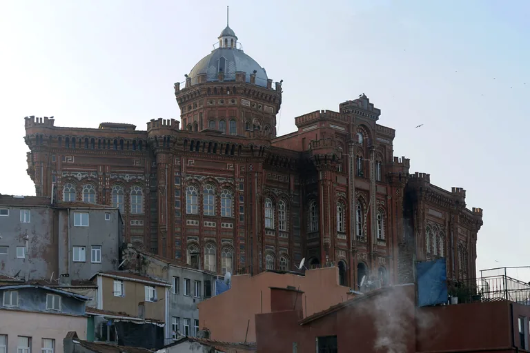 The red brick Phanar Greek Orthodox College and its domed tower above the rooftops of Fener.