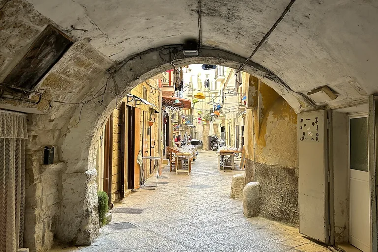 The arched entrance to Bari's Arco Basso lane.