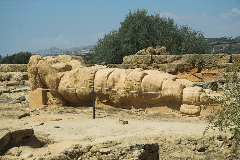 A fallen stone Telamon beside the Olympieion ruins at Agrigento.