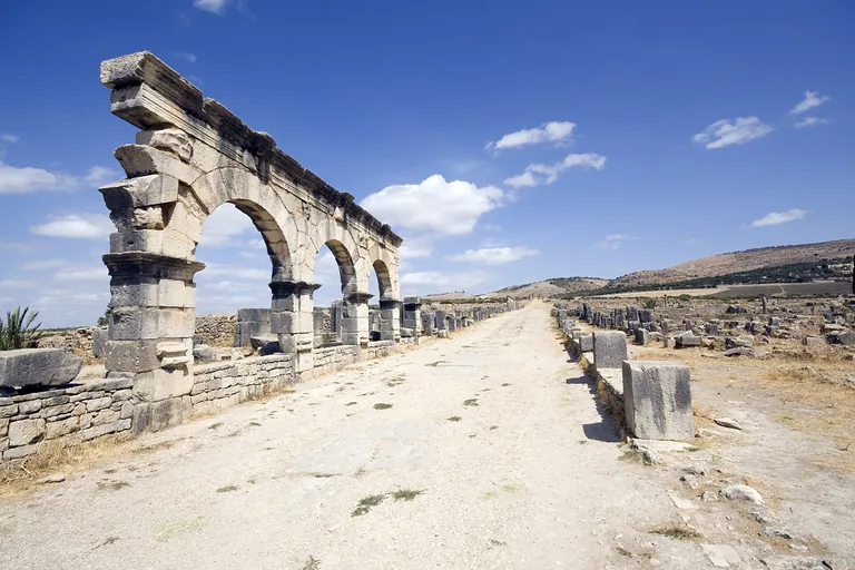 Stone arches lining the Decumanus Maximus at Volubilis.