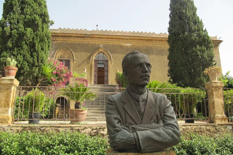 A bust of Alexander Hardcastle in the garden before Villa Aurea at Agrigento.
