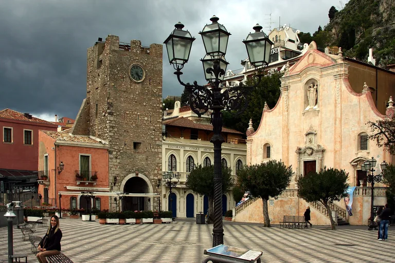 Piazza IX Aprile with its clock tower and Church of San Giuseppe in Taormina.