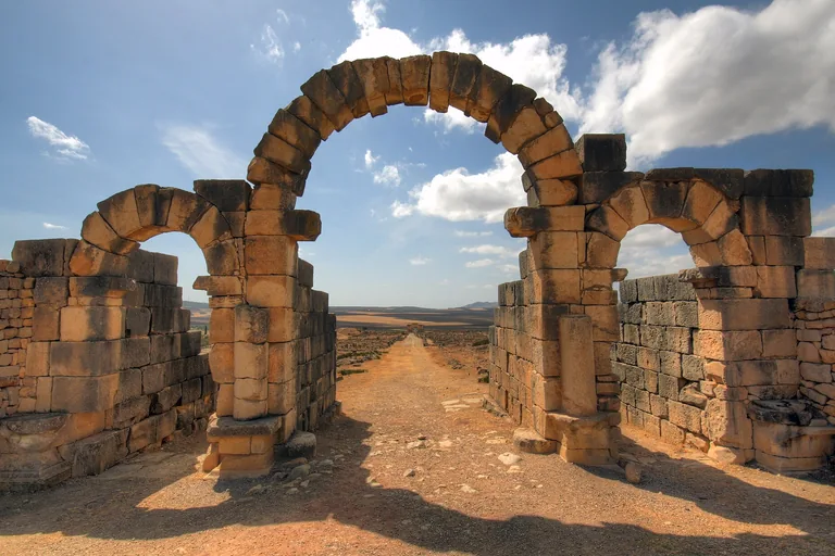 The three stone arches of Tangier Gate at Volubilis.