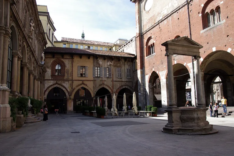 The arcaded medieval courtyard of Piazza Mercanti in Milan.