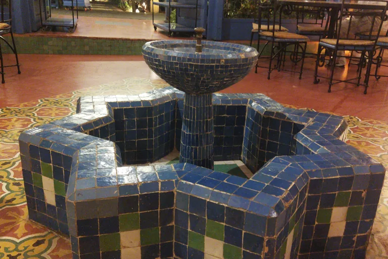 Blue-and-white tiled fountain inside the Mausoleum of Sidi Allal al-Qairawani.