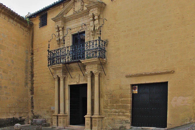 The Baroque doorway, with the four small figures carrying the pediment