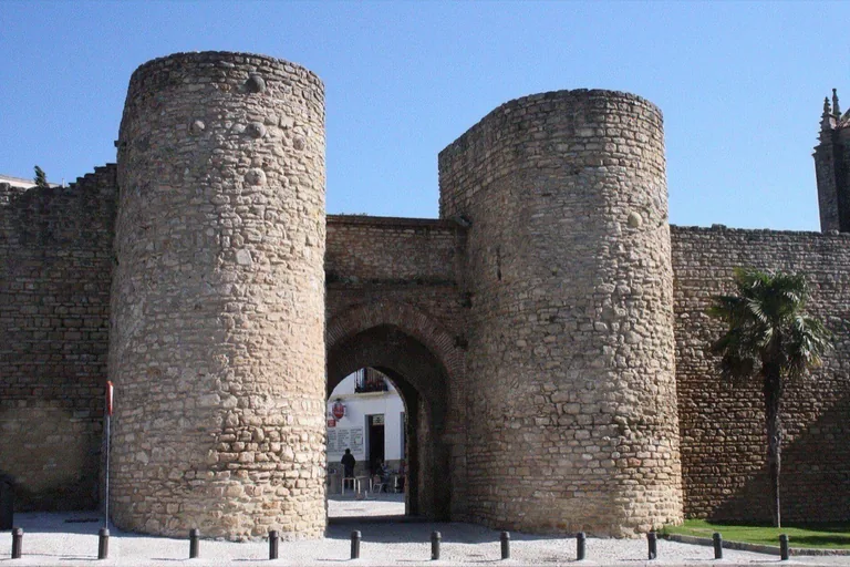 The gate and its two round flanking towers, seen from outside the walls