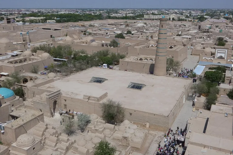 The Juma Mosque from above: a flat roof pierced by two lightwells, with its minaret on the north side