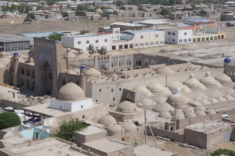 The Alla Kuli Khan madrasa's tiled portal over the ensemble's domed roofscape