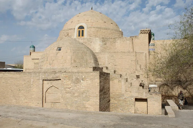 The Sayid Alauddin Mausoleum's plain brick domes — the oldest building on the walk