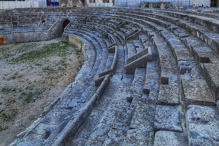 Curving stone seating inside Lecce's Roman amphitheatre.