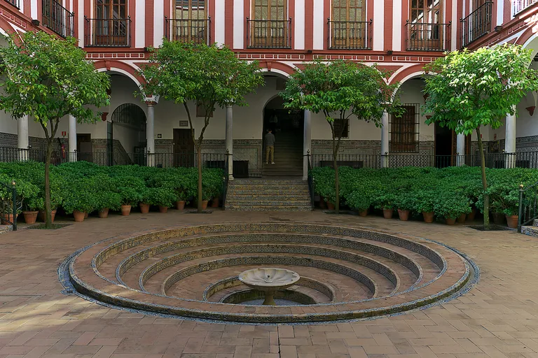 The sunken patio and circular fountain of the Venerables