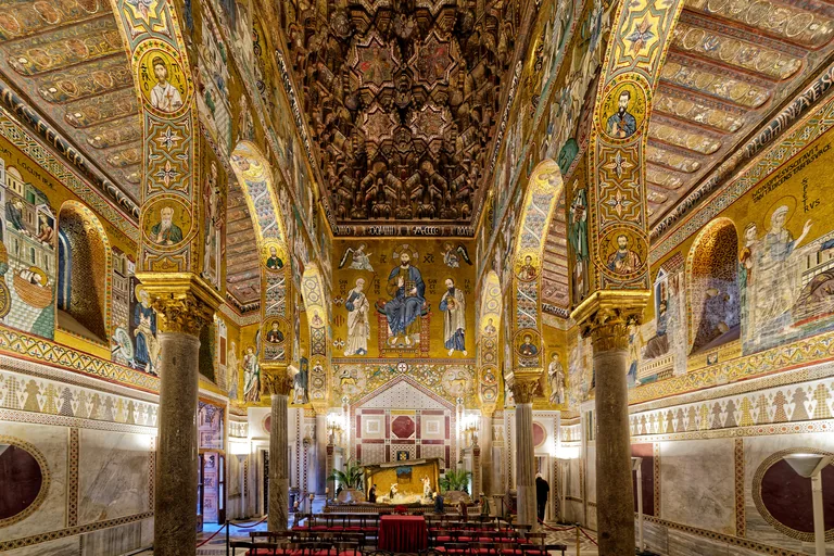 The Cappella Palatina: Byzantine mosaics above, marble opus sectile below, the painted wooden ceiling over the nave