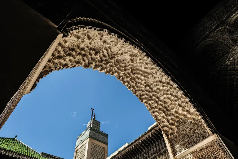 Carved stucco, cedar and the minaret at Bou Inania