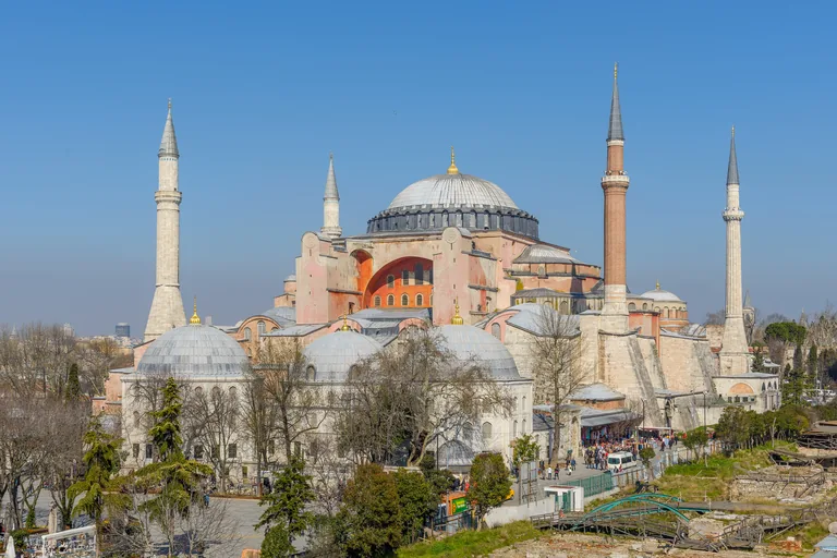 The building from the south-west, with the buttressing and the four minarets of four different builds