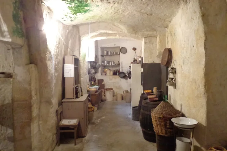 Furnished cave interior at Casa Grotta di Vico Solitario.