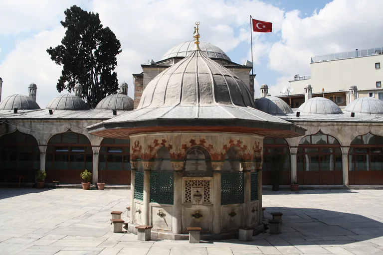The courtyard, with the ablution fountain in the middle and the madrasa cells around three sides