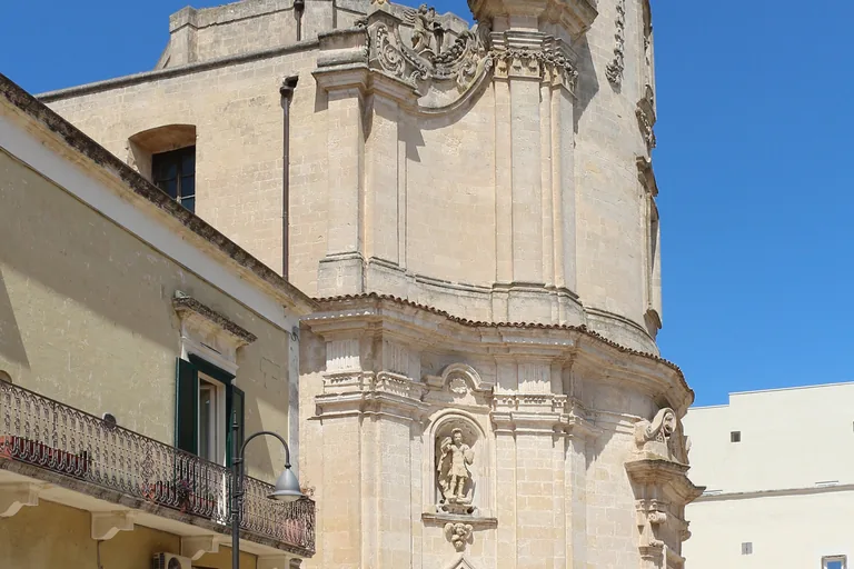 Skulls and carved ornament on the façade of Matera's Church of the Purgatorio.